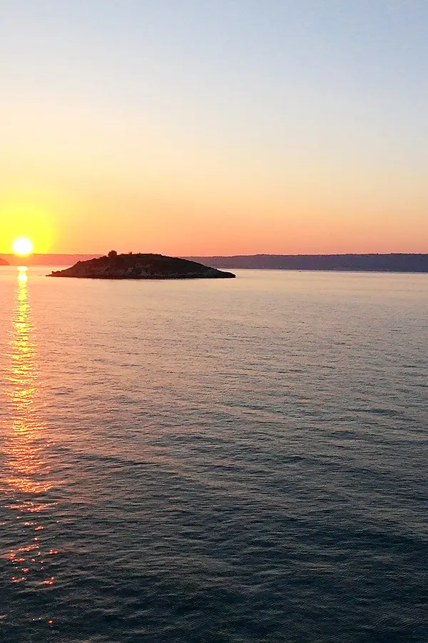 Souda Bay Sunset View Catamaran Infront of Karga Island sunset