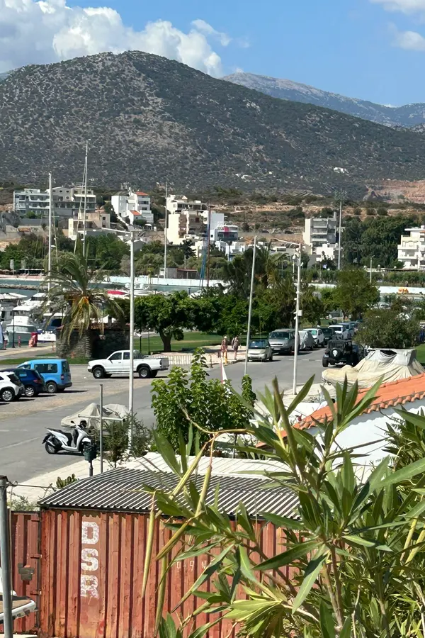 Agios Nikolaos harbor palms and mountains