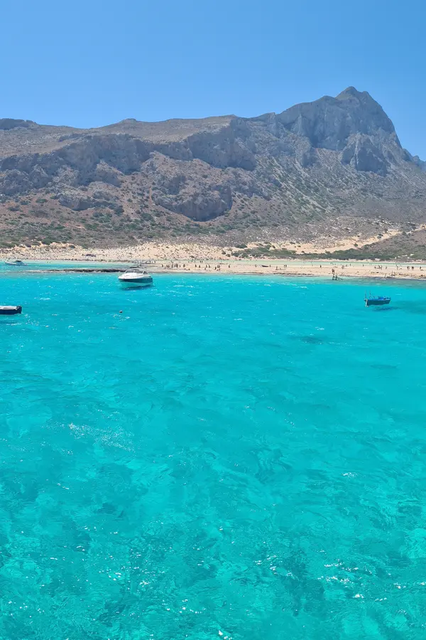 Crystal clear turquoise lagoon waters meeting a white sandy beach at Balos, western Crete.