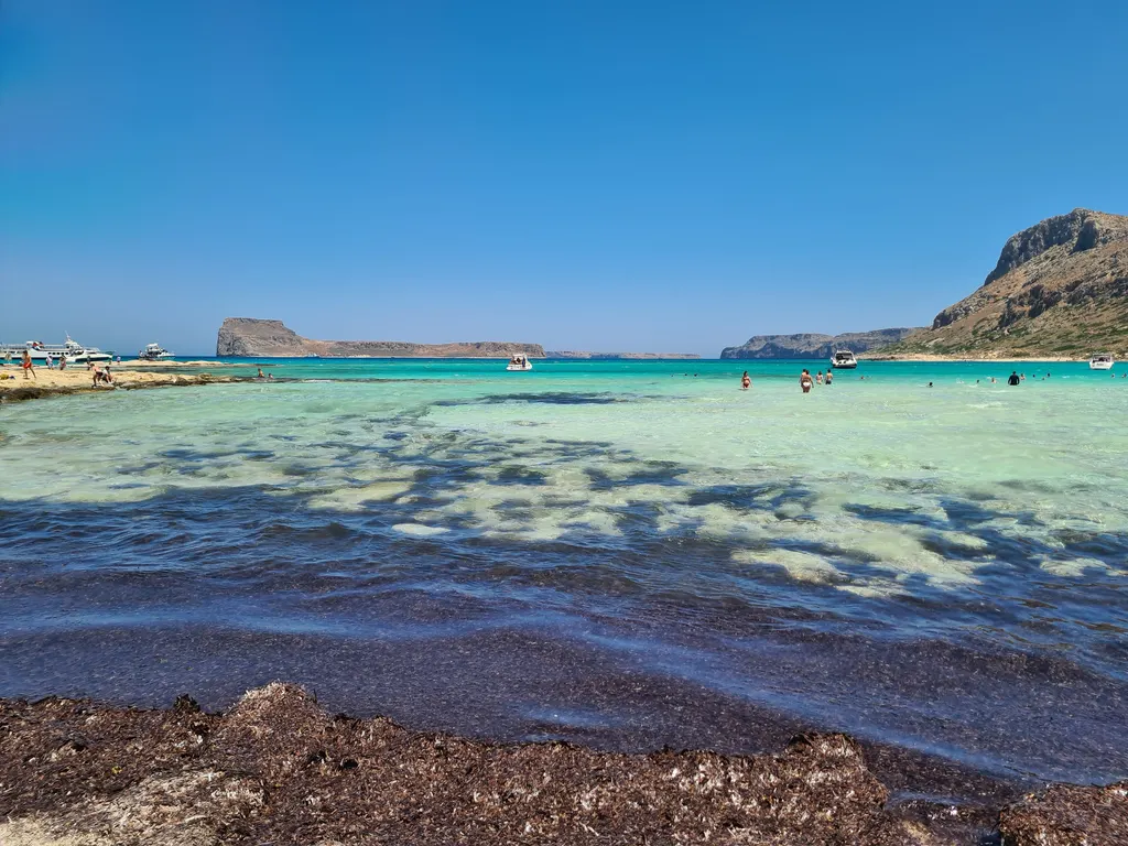 Vast view of the turquoise lagoon and bright white sandy beach at Balos, western Crete