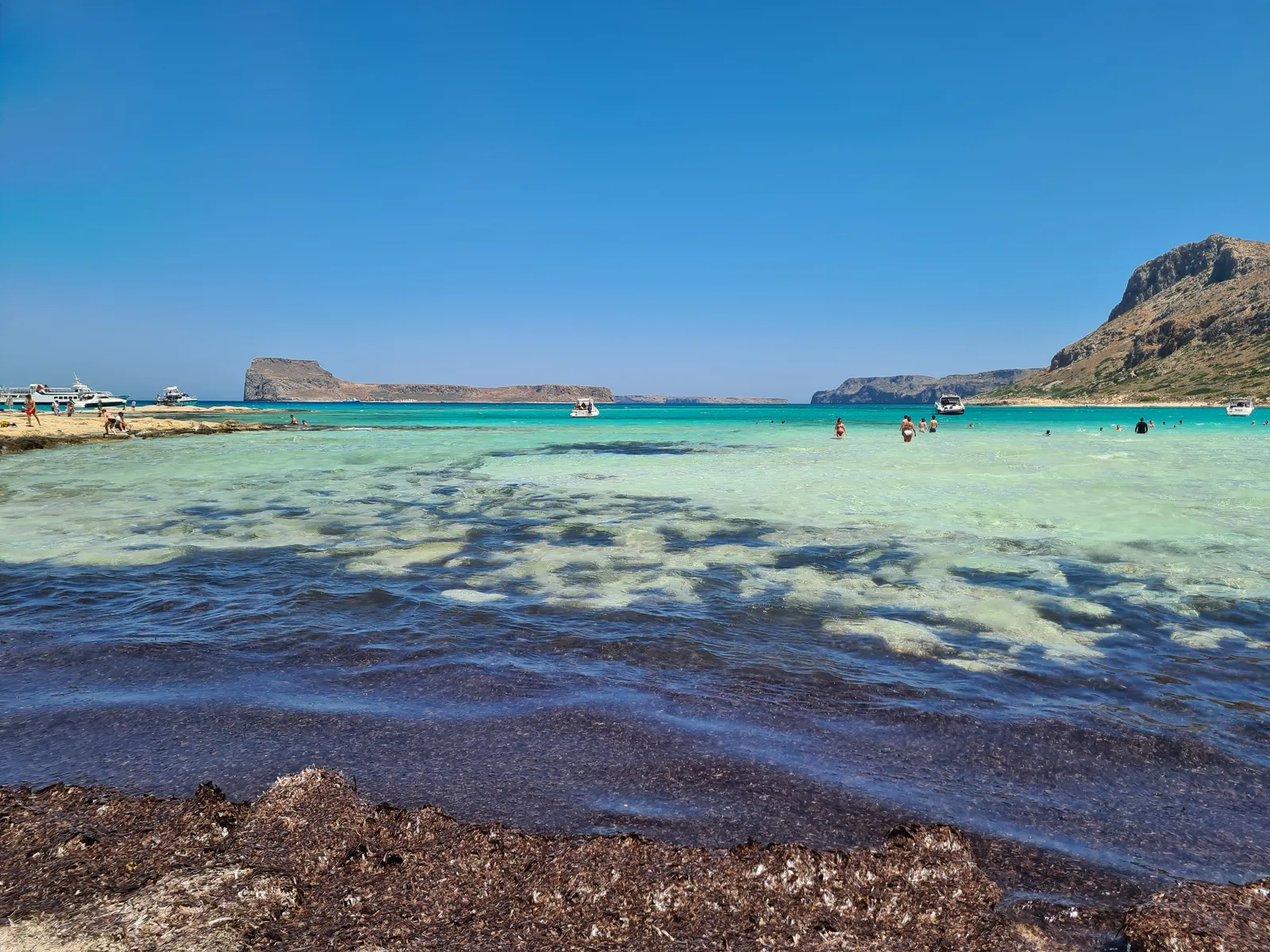 Vast view of the turquoise lagoon and bright white sandy beach at Balos, western Crete