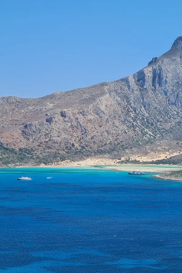 Pristine white sands meeting the brilliant turquoise lagoon at Balos, western Crete.