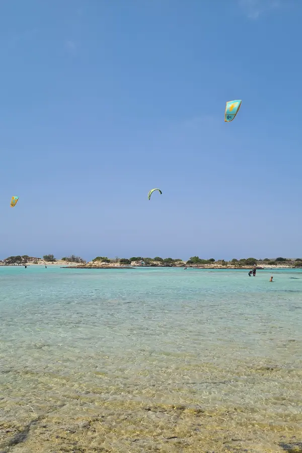 Shades of pink sand and calm lagoon waters at Elafonissi beach in southern Crete.