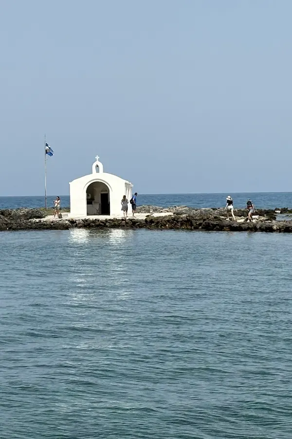 View of the golden beach and clear blue waters of Georgioupoli along the beautiful Ionian coast.