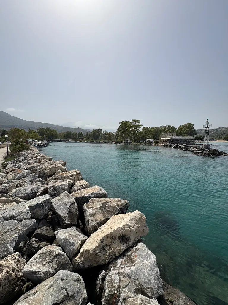 Golden sands and clear blue Aegean Sea stretching along the scenic coastline of Georgioupoli, Crete.
