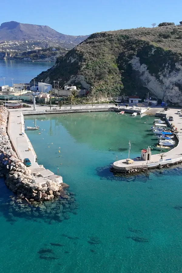 A tranquil view of the secluded bay and clear turquoise waters at Kalyves, Crete.