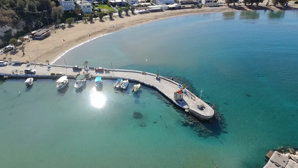 Deep blue waters meeting the shore at Kalyves, offering views of the rugged Cretan coastline.