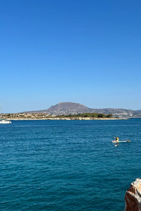 Coastal view showcasing the unique architecture and bright blue waters at Marathi, northern Crete