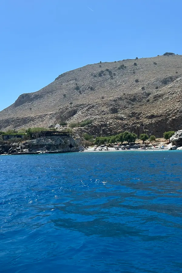 Dramatic white cliffs plunging into the deep blue sea at Marmara cape, Crete.