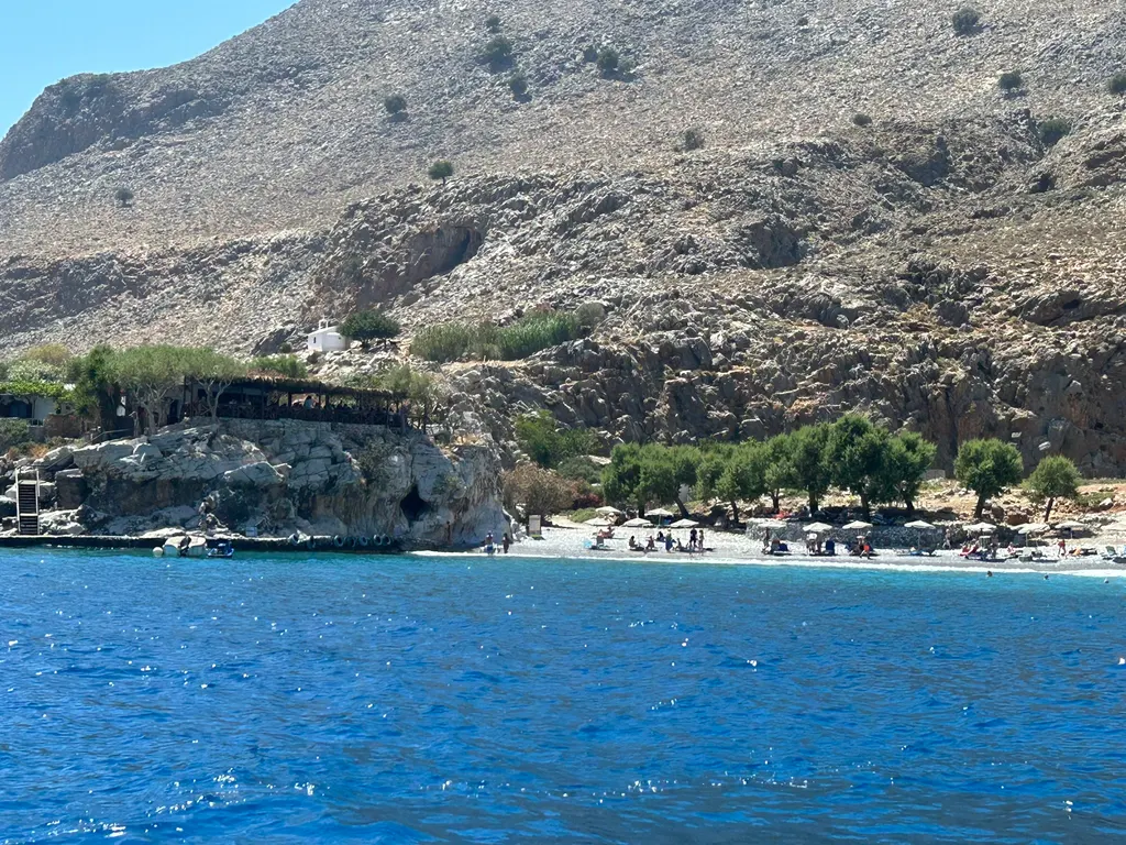 Coastal views of Marmara, showing dramatic cliffs meeting the deep blue waters off the Cretan shore.