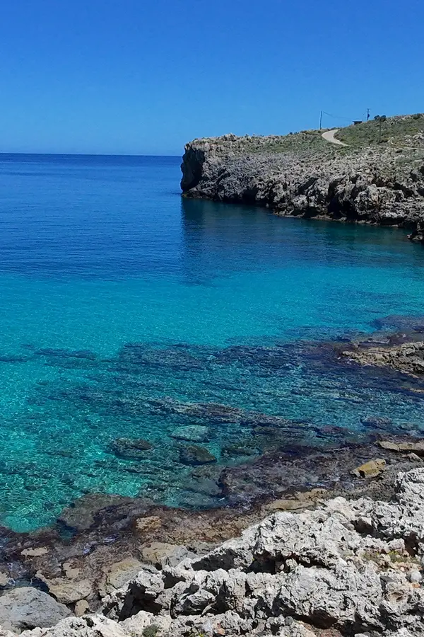 Coastal panorama showing clear Mediterranean waters and the cliffs of Ombrosgialos on the Cretan coastline.