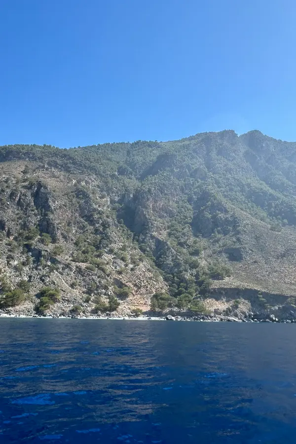The dramatic, rugged coastline and clear blue waters at Sendoni, a captivating spot on the southern coast of Crete.