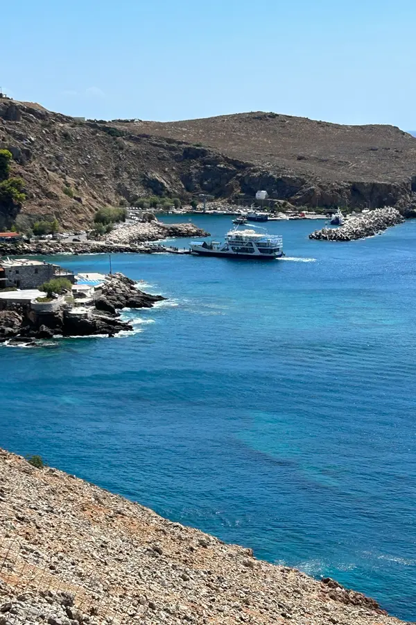 Dramatic mountains descending to deep blue waters along the rugged coastline of Sfakia, Crete