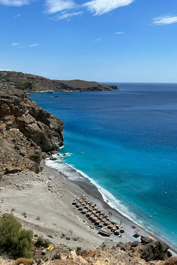 Dramatic, mountainous coastal cliffs plunging into deep blue waters at Sfakia, Crete.