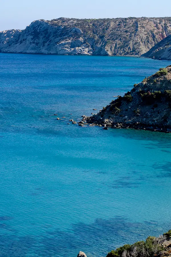 Turquoise waters and dramatic cliffs defining the remote southern coast of Gavdos Island, Crete